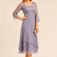 Embroidered chiffon mother of the bride dress by THE WHITMORE FAMILY, featuring delicate embroidery and elegant flowy fabric.