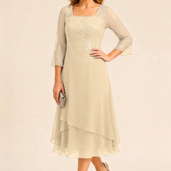 Embroidered chiffon mother of the bride dress by THE WHITMORE FAMILY, featuring elegant embroidery and flowing fabric in a stylish design.