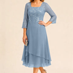 Embroidered chiffon mother of the bride dress by THE WHITMORE FAMILY in a stylish, elegant design with intricate embroidery.