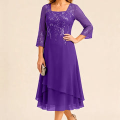 Embroidered chiffon mother of the bride dress by THE WHITMORE FAMILY, featuring elegant embroidery and flowy chiffon fabric.