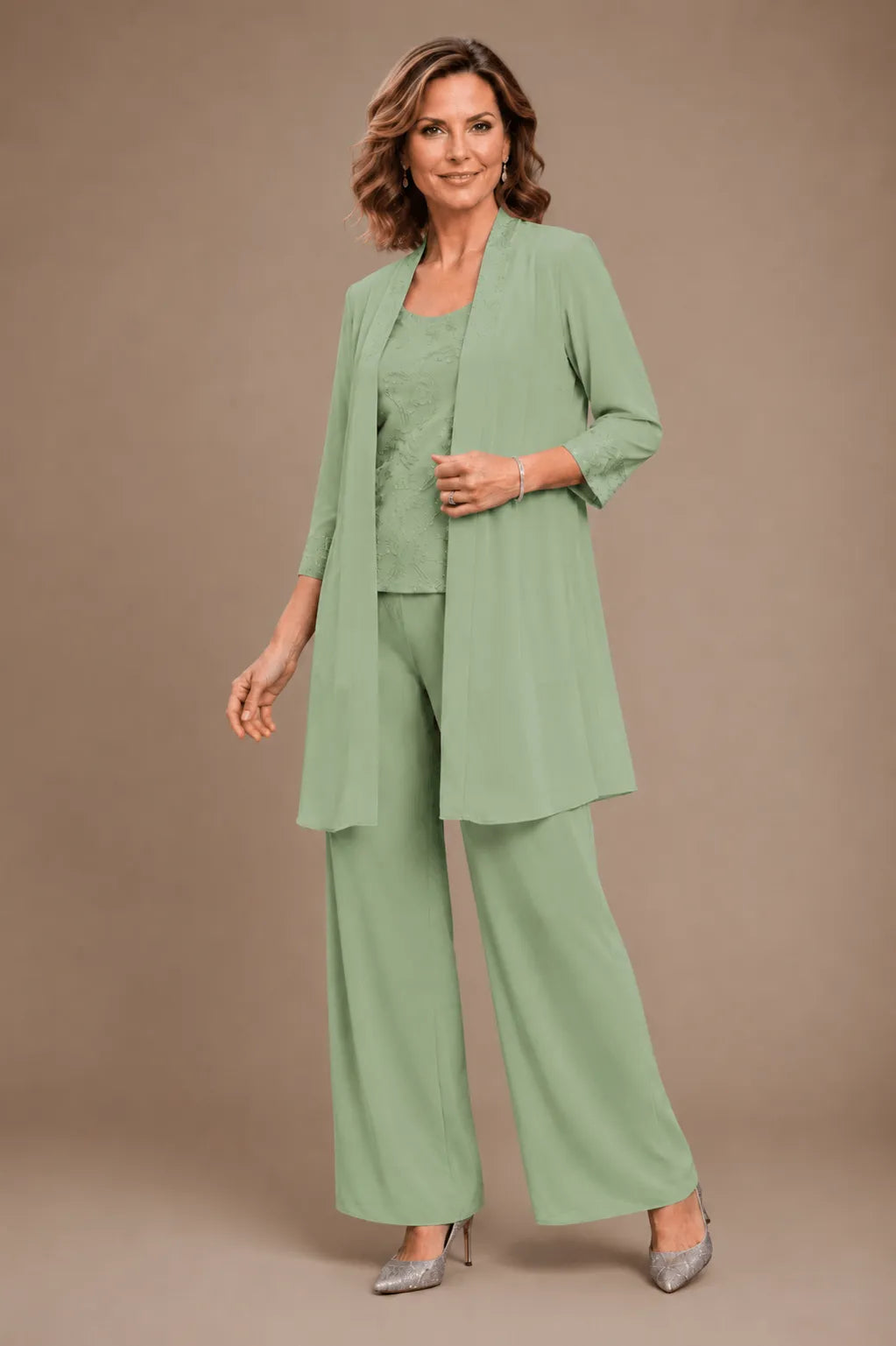 Evelyn embroidered three-piece pant set dress by THE WHITMORE FAMILY with colorful embroidery and relaxed fit, styled on a model.