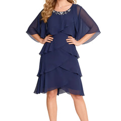 Dark navy chic tiered chiffon dress with sheer long sleeves by THE WHITMORE FAMILY, featuring elegant flowing fabric and sophisticated style.