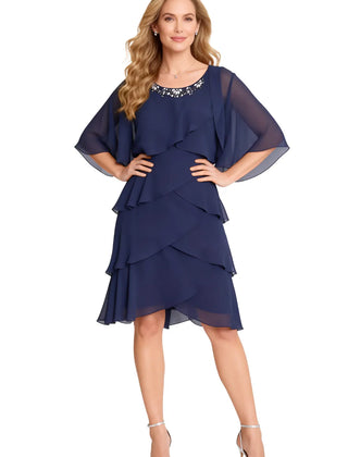 Dark navy chic tiered chiffon dress with sheer long sleeves by THE WHITMORE FAMILY, featuring elegant flowing fabric and sophisticated style.