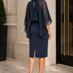 Dark navy elegant formal dress with cape sleeves by THE WHITMORE FAMILY, featuring a sophisticated, flowing design.