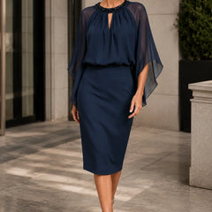Dark navy elegant formal dress with cape sleeves by THE WHITMORE FAMILY, showcasing a sophisticated and stylish design.