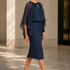 Dark navy elegant cape sleeve formal dress by THE WHITMORE FAMILY, showcasing a sophisticated design with flowing cape sleeves.