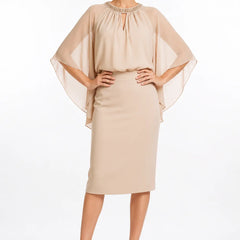 Dark navy elegant formal dress with cape sleeves by THE WHITMORE FAMILY, featuring a sophisticated design and flowing silhouette.