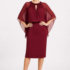 Dark navy elegant formal dress with cape sleeves by THE WHITMORE FAMILY, featuring a sophisticated and stylish design.