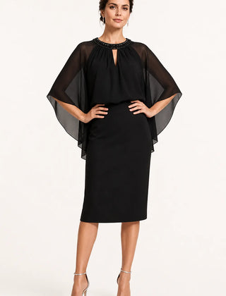 Dark navy elegant formal dress with cape sleeves by THE WHITMORE FAMILY, showcasing a sophisticated evening wear style.
