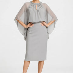 Dark navy elegant formal dress with cape sleeves by THE WHITMORE FAMILY, featuring a sophisticated design for special occasions.