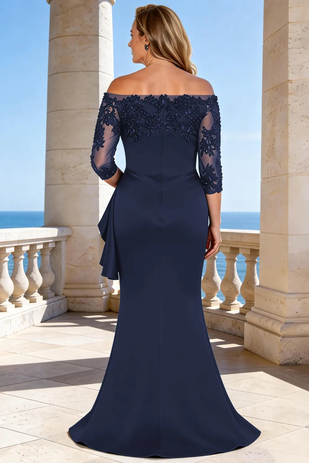 Elegant dark navy floor-length lace sleeve formal dress by THE WHITMORE FAMILY, showcasing intricate lace details and flowing silhouette.