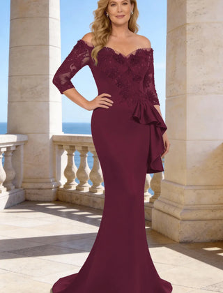 Dark navy elegant floor-length lace sleeve formal dress by THE WHITMORE FAMILY, showcasing intricate lace details and a flowing silhouette.