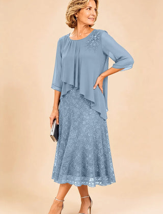 Dark navy lace overlay chiffon mother of the bride dress by THE WHITMORE FAMILY with elegant lace details and flowing chiffon fabric.