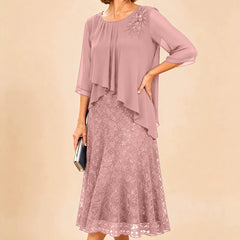 Dark navy lace overlay chiffon mother of the bride dress by THE WHITMORE FAMILY, featuring elegant lace details and flowing chiffon fabric.