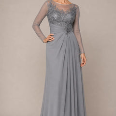Sheer lace bodice A-line evening dress in dusty blue by THE WHITMORE FAMILY, featuring elegant lace details and a flowing silhouette.