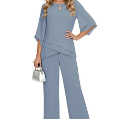 Sophisticated loose-fit formal pant set dress by THE WHITMORE FAMILY in dusty blue, featuring elegant chiffon fabric and tailored design.