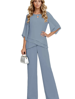 Sophisticated loose-fit formal pant set dress by THE WHITMORE FAMILY in dusty blue, featuring elegant chiffon fabric and tailored design.