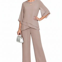 Sophisticated loose-fit formal pant set dress by THE WHITMORE FAMILY in mauve taupe, featuring tailored pants and a matching top.
