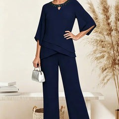 Navy loose-fit formal pant set dress by THE WHITMORE FAMILY, featuring elegant tailored trousers for a sophisticated look.