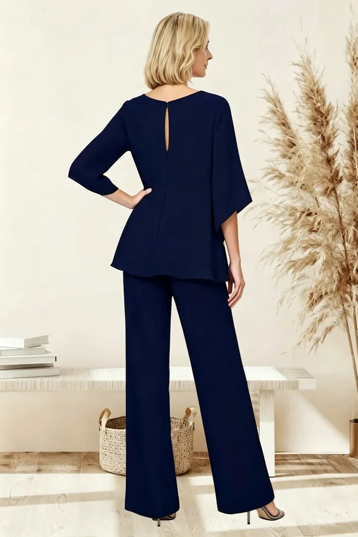 Sophisticated loose-fit formal pant dress set by THE WHITMORE FAMILY, shown from the back with tailored design and elegant silhouette.