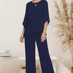 Sophisticated loose-fit formal pant set dress by THE WHITMORE FAMILY, featuring tailored design and elegant detailing.