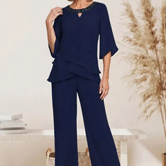 Sophisticated loose-fit formal pant dress set by THE WHITMORE FAMILY, featuring a stylish front view of the mother-of-the-bride pant suit.