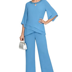 Blue loose-fit formal pant dress set by THE WHITMORE FAMILY, featuring elegant tailored trousers and a matching top.