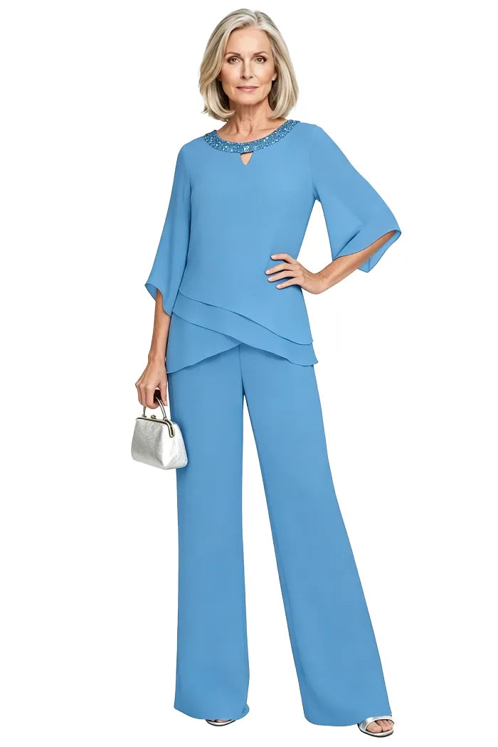 Blue loose-fit formal pant dress set by THE WHITMORE FAMILY, featuring elegant tailored trousers and a matching top.
