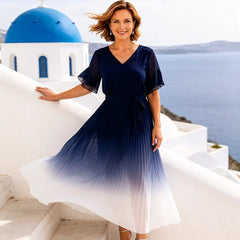 Dark navy tie waist chiffon midi dress with flutter sleeves by THE WHITMORE FAMILY, featuring elegant, flowing fabric and feminine design.