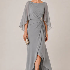 Dark navy chiffon cape sleeve wrap formal dress by THE WHITMORE FAMILY with a decorative brooch, elegant and flowing design.