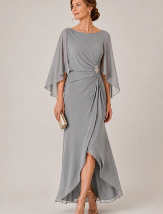 Dark navy chiffon cape sleeve wrap formal dress by THE WHITMORE FAMILY with a decorative brooch, elegant and flowing design.