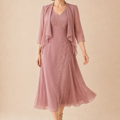 Dusty rose V-neck chiffon midi dress with lace detail by THE WHITMORE FAMILY, stylish and elegant for special occasions.