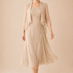 V neck chiffon midi dress with lace detail by THE WHITMORE FAMILY, featuring a flowing silhouette and elegant design in champagne.