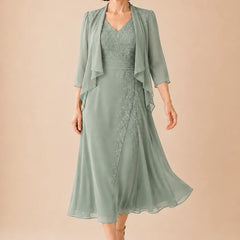 V-neck chiffon midi dress with lace detail in dusty sage, designed by THE WHITMORE FAMILY, elegant and flowy for special occasions.