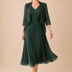 Elegant emerald V-neck chiffon midi dress with lace details by THE WHITMORE FAMILY, perfect for special occasions.