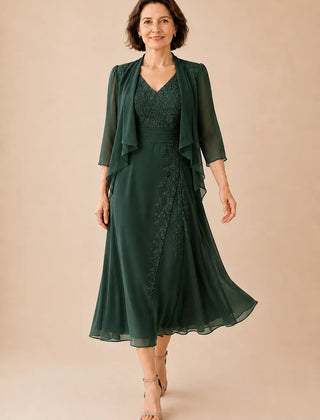 Elegant emerald V-neck chiffon midi dress with lace details by THE WHITMORE FAMILY, perfect for special occasions.
