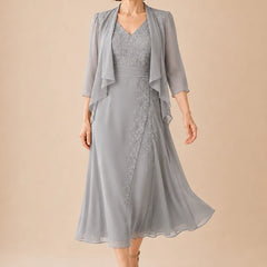 V-neck chiffon midi dress with lace detail by THE WHITMORE FAMILY, featuring a flowing silhouette and elegant design.
