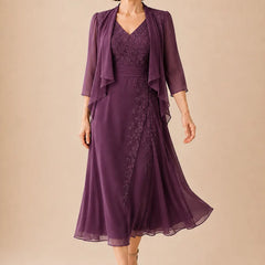 V-neck chiffon midi dress with lace detail in plum, by THE WHITMORE FAMILY, featuring elegant flowy fabric and sophisticated design.