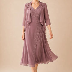 V-neck chiffon midi dress with lace detail by THE WHITMORE FAMILY, featuring a flowing silhouette and elegant design.