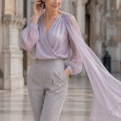 Lilac chiffon cape blouse by THE WHITMORE FAMILY, elegant wedding guest dress with romantic flowy fabric and stylish design.