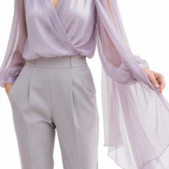 Elegant chiffon cape wedding guest blouse by THE WHITMORE FAMILY, featuring delicate fabric details and a romantic style.