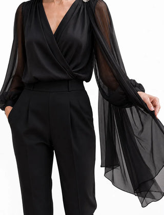 Black chiffon cape blouse from THE WHITMORE FAMILY, elegant wedding guest dress with flowy, romantic design.