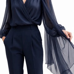Dark navy chiffon cape blouse by THE WHITMORE FAMILY, featuring elegant, flowy fabric and stylish design for wedding guest attire.