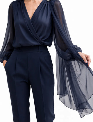 Dark navy chiffon cape blouse by THE WHITMORE FAMILY, featuring elegant, flowy fabric and stylish design for wedding guest attire.