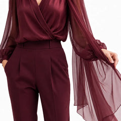 Wine red chiffon cape blouse by THE WHITMORE FAMILY, featuring a romantic, elegant design with flowing fabric and delicate details.