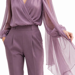 Romantic chiffon cape blouse by THE WHITMORE FAMILY, elegant wisteria-colored dress with flowing chiffon cape for wedding guests.
