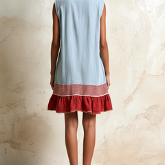Light blue Hazel™ Ruffle Hem Tunic Dress by THE WHITMORE FAMILY, featuring a flowy silhouette and ruffle details.