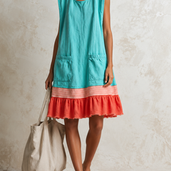 Light blue Hazel™ Ruffle Hem Tunic Dress by THE WHITMORE FAMILY, featuring a flowy silhouette and ruffled hem detail.