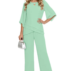Sophisticated loose-fit formal pant set by THE WHITMORE FAMILY, mint chiffon dress with elegant tailoring and relaxed fit.
