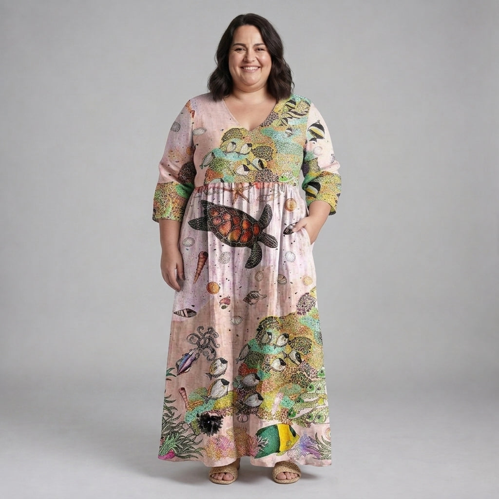 Marisella Ocean Whimsy Maxi Dress by THE WHITMORE FAMILY featuring flowing fabric and ocean-inspired print on a stylish dress.